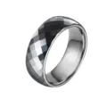 Detailed view of an 8mm faceted tungsten carbide ring with geometric black silver design. - US 11 / Silver