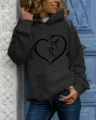 Close-up of women's black hoodie with cute cat heart print, long sleeves and cozy hood. - S / Tops / Black