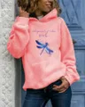 Casual long sleeve hooded sweatshirt featuring blue dragonfly graphic and inspiring text. - Pink