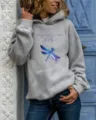 Lässiger Langarm Kapuzenpullover für Damen mit blauem Libellen-Print und inspirierendem Text. - S / Oberteile / Grau