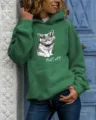 Detail view of women's long sleeve hooded sweatshirt featuring cute cat graphic and text print. - S / Tops / Green