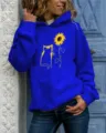 Detailed view of the royal blue hoodie featuring a cat and sunflower print graphic. - Sapphire Blue