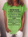 Llässiges grünes Kurzarm-T-Shirt mit lustigem Pferd-Druck für bequeme tägliche Freizeit. - S / Oberteile / Grün