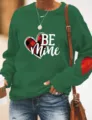 Vista detallada de la sudadera verde de San Valentín con diseño de corazón Be Mine y parche en codo. - Verde