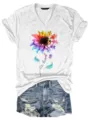 Detailed view of women's short sleeve V-neck t-shirt with colorful puzzle sunflower graphic. - S / Tops / White