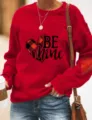 Valentine's Day red crewneck sweatshirt with buffalo plaid heart print and 'BE MINE' text. - S / Tops / Red