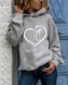 Detailed view of women casual gray hooded sweatshirt featuring cute cat heart graphic print. - S / Tops / Gray