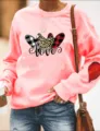 Pink long sleeve sweatshirt with love heart graphic and cute patchwork elbow detail. - Pink