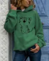 Detail view of the green hooded sweatshirt featuring a cute cartoon cat graphic and pocket. - S / Tops / Sapphire Blue