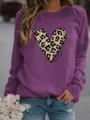 Women's purple long sleeve sweatshirt with leopard heart print graphic casual pullover top. - Light Purple