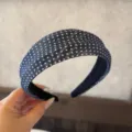 Detailed view of the blue polka dot fabric headband, stylish hair accessory for daily wear. - Navy Blue Textured Headband