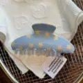 Close up detail of cute blue star pattern acetate hair claw clip showcasing fine texture. - Blue Star Fan-shaped Claw