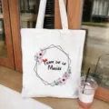 Canvas tote bag detail view showing elegant floral geometric print and French text design. - White Floral Style (7)