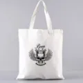 Weiße Canvas-Einkaufstasche mit Totenkopf-Print, lässige Schultertasche für den täglichen Gebrauch. - Rockstar Krone Flügel Stil (15) / 35*40cm