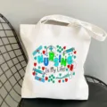 Weisse Segeltuchtasche mit Pflege Druck Design, lässige Schultertasche für den Alltag. - Medizinischer Tribut Handschrift Stil / L
