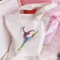Detail view of white canvas tote bag featuring colorful watercolor ballet dancer art for daily use. - Ballet Girl Print (Style 4) / 35*40cm