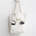 Canvas tote bag with cute wink eye and crown print, stylish and durable everyday shoulder bag. - Long Eyelash Crown Style / 35x40cm