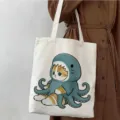 Bolso tote de lona estampado de gato de dibujos animados, bolso de hombro elegante para escuela. - Estilo de Gato con Disfraz de Pulpo