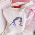 Detailed closeup of a white canvas tote bag featuring a vibrant watercolor dancer print design. - Ballet Girl Print (Style 1) / 35*40cm
