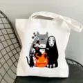 Detailed view of the white canvas tote bag featuring cute cartoon anime character graphics. - Style 22 / 35*40cm