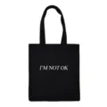 Black canvas tote bag detail view, featuring simple quote print design for daily casual wear. - Negative Mood Slogan Style 7 / Normal Packaging / Black