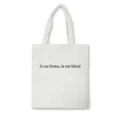 Detail shot of white canvas tote bag featuring black typography print. Simple aesthetic. - Simple English Sentence Style 6 / Normal Packaging / White