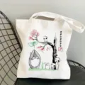 Detail shot of white canvas tote bag with Ghibli anime ink print, casual shoulder handbag. - Style 20 / 35*40cm