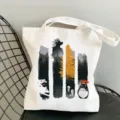 White canvas tote bag featuring cute anime character print, casual daily shoulder shopping bag. - Style 10 / 35*40cm