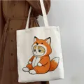 Bolso tote de lona con lindo estampado de gato, bolso de hombro casual para la escuela y el trabajo. - Estilo de Gato con Capucha de Zorro