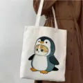 Bolsa tote de lona con estampado de dibujos, bolso de hombro elegante para escuela. - Estilo de Gato con Disfraz de Pingüino