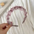 Detail view of a chic pink leopard print mesh headband with inner teeth, elegant hair accessory. - Teeth Headband / Pink Leopard Print