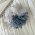 Detail view of the two-tone sheer scrunchie, showcasing white and blue leopard mesh. - Contrast Scrunchie Style / Blue Leopard Print