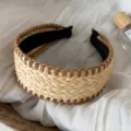 Detailed shot of a wide woven straw headband with brown stitching and black lining for summer. - Edged Straw Headband - Brown Edge