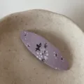 Exquisite floral fabric BB hair clip detailed view, cute Korean style snap pin for women and girls. - Purple Oval