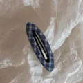 Close up detail of a cute blue plaid fabric snap hair clip, perfect for daily styling. - Blue Series Hollow Oval BB - Dark Blue Plaid