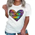 Close-up detail of women short sleeve t-shirt featuring colorful tie dye heart graphic. - S / Tops / White
