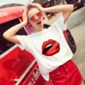 Detailed view of the casual white short sleeve t-shirt featuring a striking red lips print. - S / Tops / Red Lip Print (1)