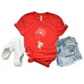 Red short-sleeve t-shirt detail showing cute elephant and dandelion print, casual style. - Red