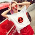 Detailed view of white short-sleeve T-shirt featuring a trendy red lips and strawberry graphic. - S / Tops / Red Lip Strawberry Print (2)