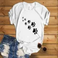 Details of white short sleeve t-shirt with black paw print graphic and casual denim shorts. - S / Tops / White (Black Paw Print)