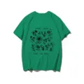 Detailed view of green short-sleeve t-shirt featuring black botanical plant and bee print graphic. - S / Tops / Green