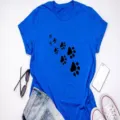 Casual blue short sleeve women's t-shirt featuring a cute black cat paw print graphic. - Royal Blue (Black Paw Print)