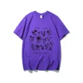 Close-up detail of the botanical print graphic and slogan on the purple cotton t-shirt. - S / Tops / Purple