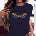 T-shirt femme décontracté bleu foncé à manches courtes avec imprimé graphique de libellule. - Bleu marine