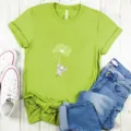 Green short-sleeve t-shirt detail featuring a cute elephant dandelion graphic and casual flat lay. - Fluorescent Green