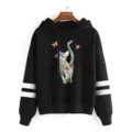 Black hoodie with colorful cat graphic and white sleeve stripes for casual daily wear. - Black