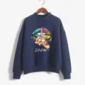 Detailed view of the dark blue mock-neck sweatshirt featuring a colorful graphic art print. - Navy Blue