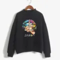 Close-up detail of women's black high-neck sweatshirt with colorful artistic lip print. - Black
