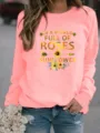 Casual dames sweater met lange mouwen en ronde hals met inspirerende zonnebloem print. - Roze