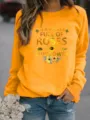 Oranje damestrui met ronde hals en lange mouwen met zonnebloem tekst grafisch detail. - Geel